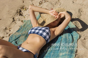 anna Kosturova swim lookbook with gingham and sailor stripe bikinis, boho blouse and maxi dresses