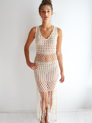 Anna Kosturova Handmade crochet dress with a peekaboo midsection, unique festival outfit with dramatic fringe hem. 