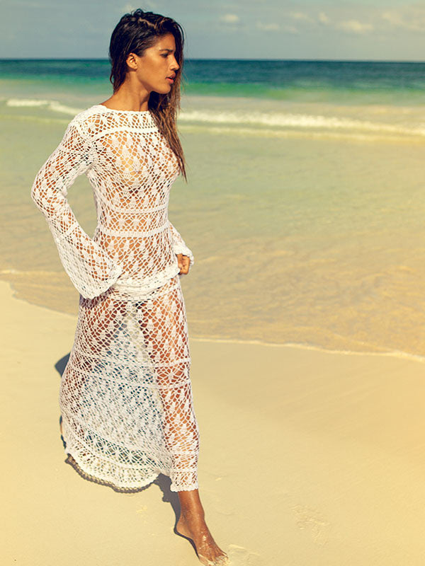 Anna Kosturova handmade crochet maxi dress in lacy stitch pattern. Lace up front bodice. Crochet lace bohemian wedding dress for beach destination. Long Sleeve Fit and flare boho bride.